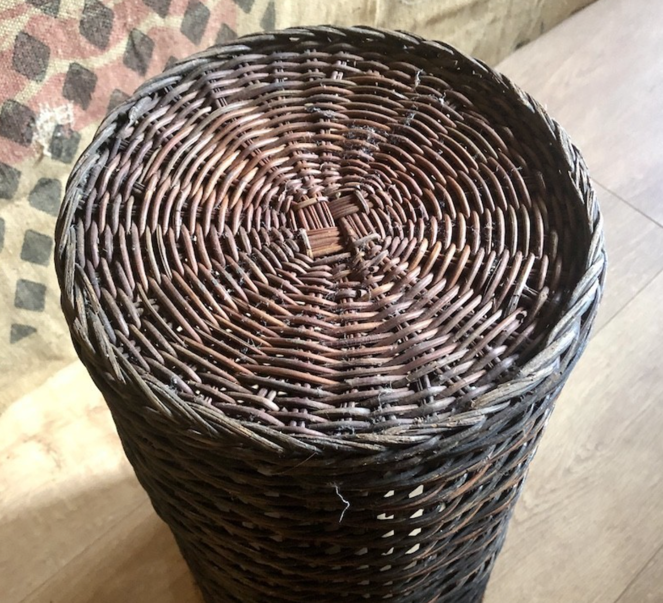 High basket in braided wicker