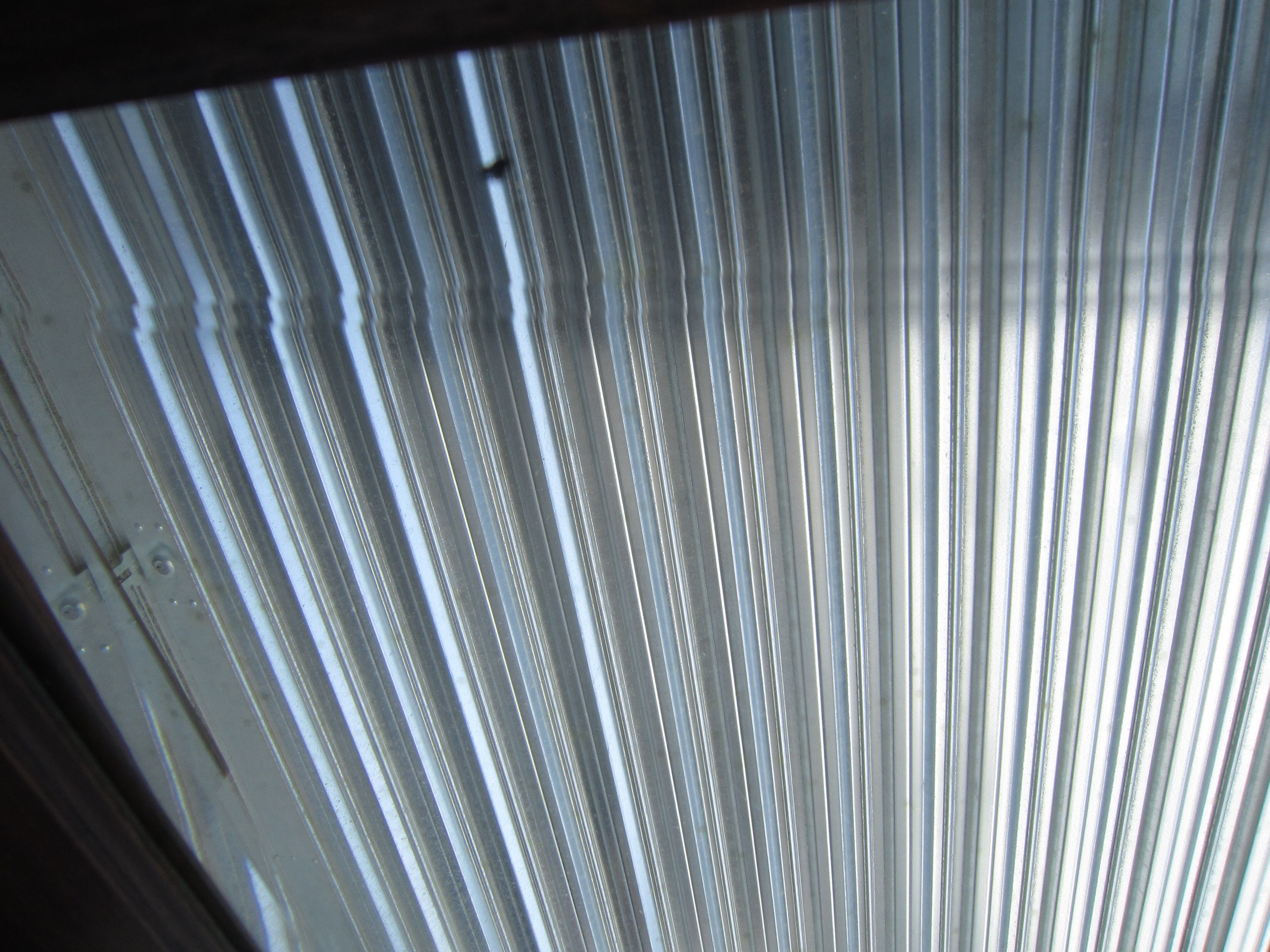 Vestiaire wears hat coat and art deco umbrella in wrought iron patere wood