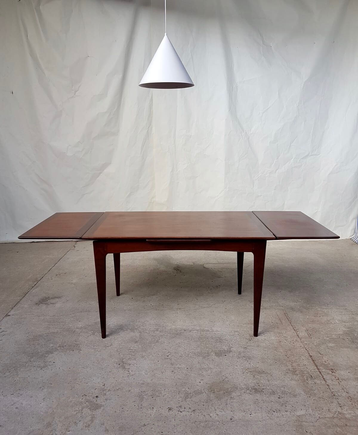 Teak extending dining table by Younger
