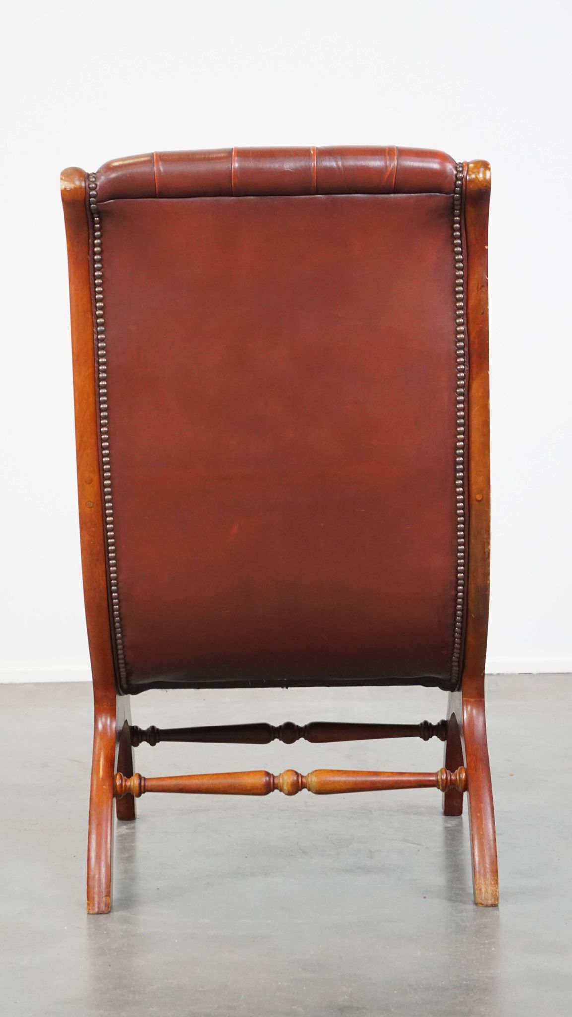 Red cowhide leather English Chesterfield armchair combined with wood