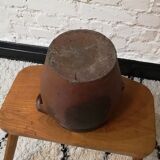 Old red and black terracotta grease pot