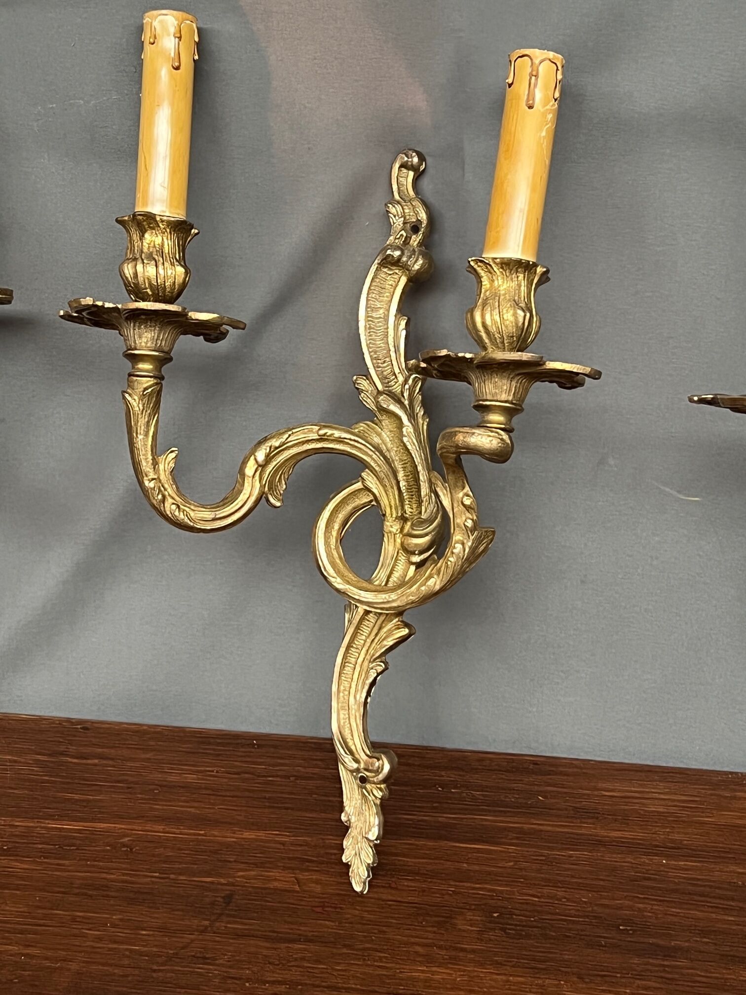 Set of three bronze wall sconces.