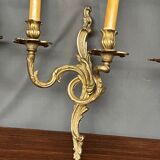 Set of three bronze wall sconces.