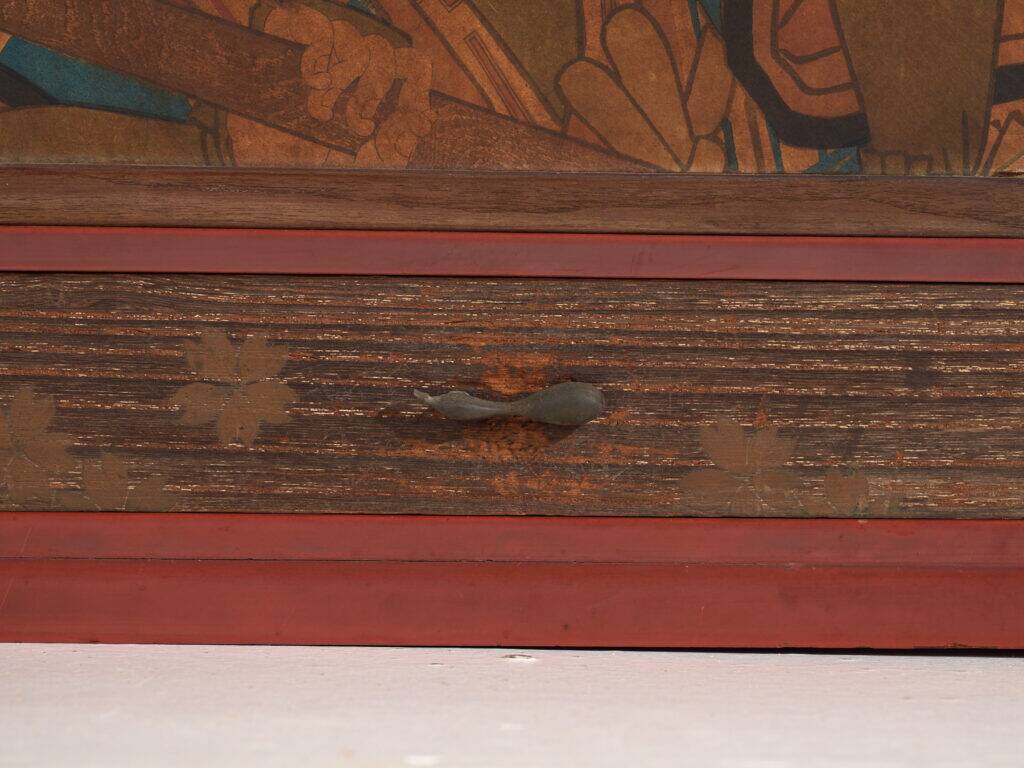 Small Japanese cabinet with sliding doors, Kabuki decoration, made of paulownia wood, early Showa period, circa 1926–1970.