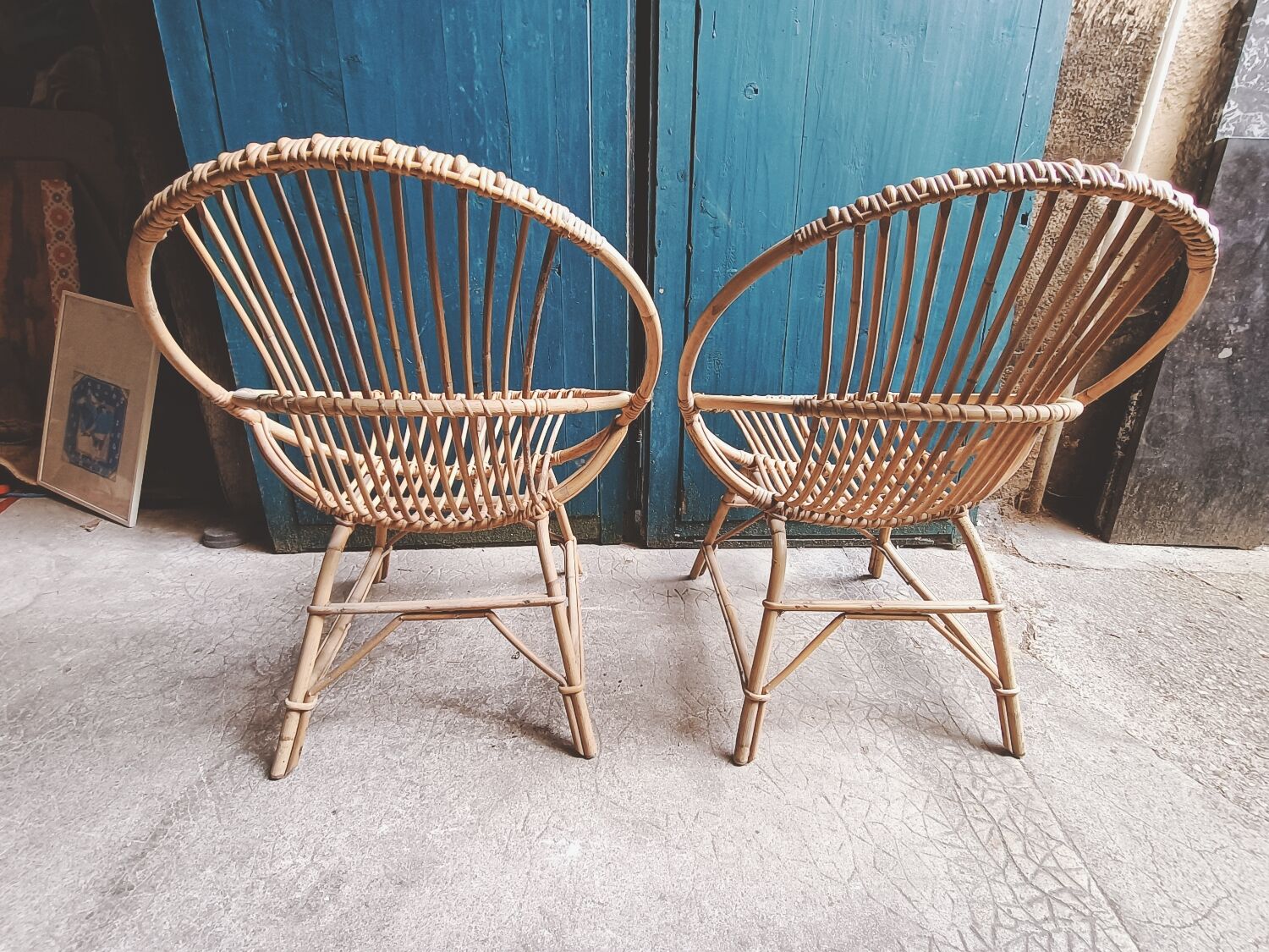 Paire de fauteuils coquille en rotin vintage 1960