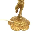 Lampe à poser cherubin en laiton.