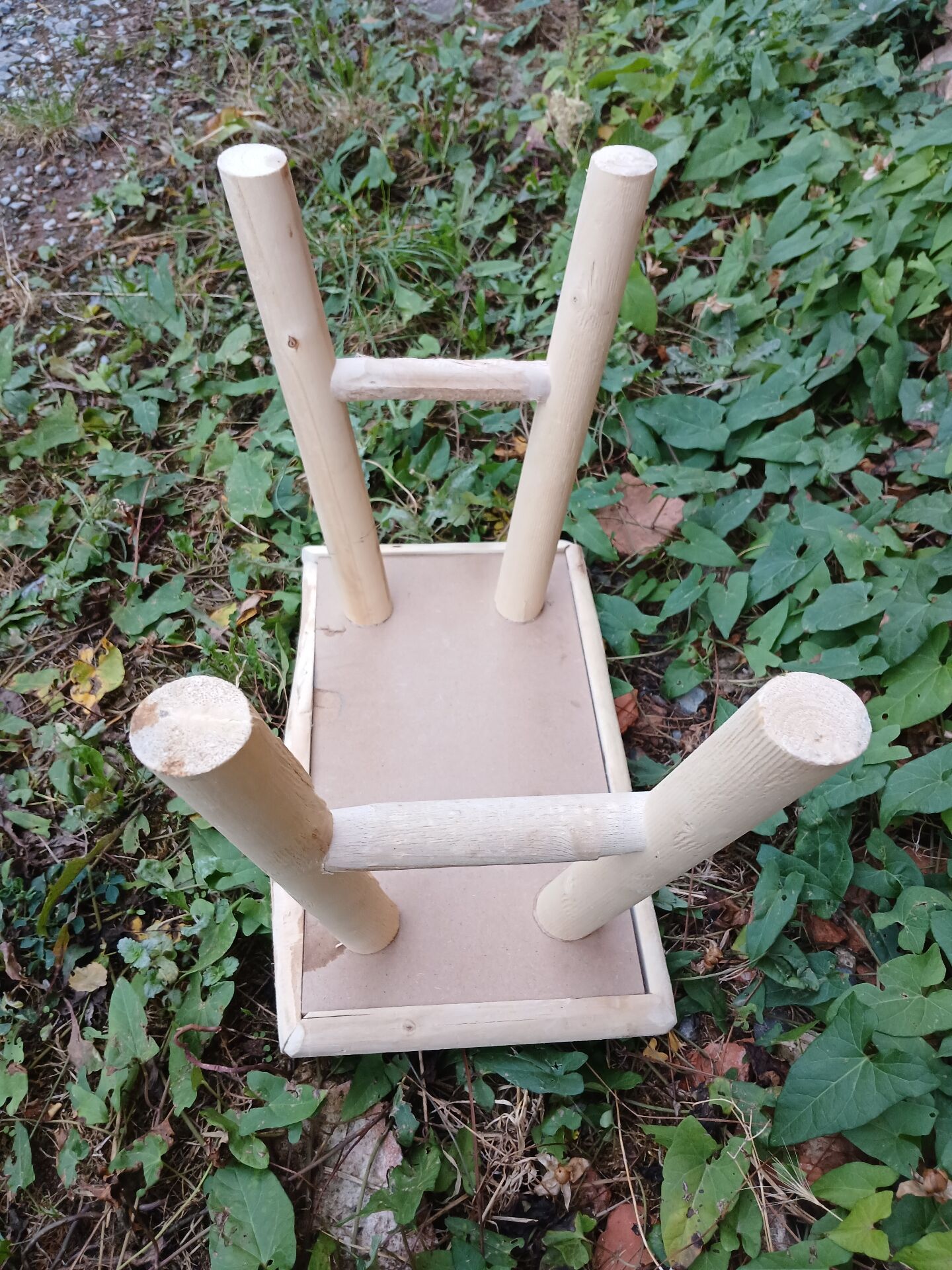 Small stool in raw wood