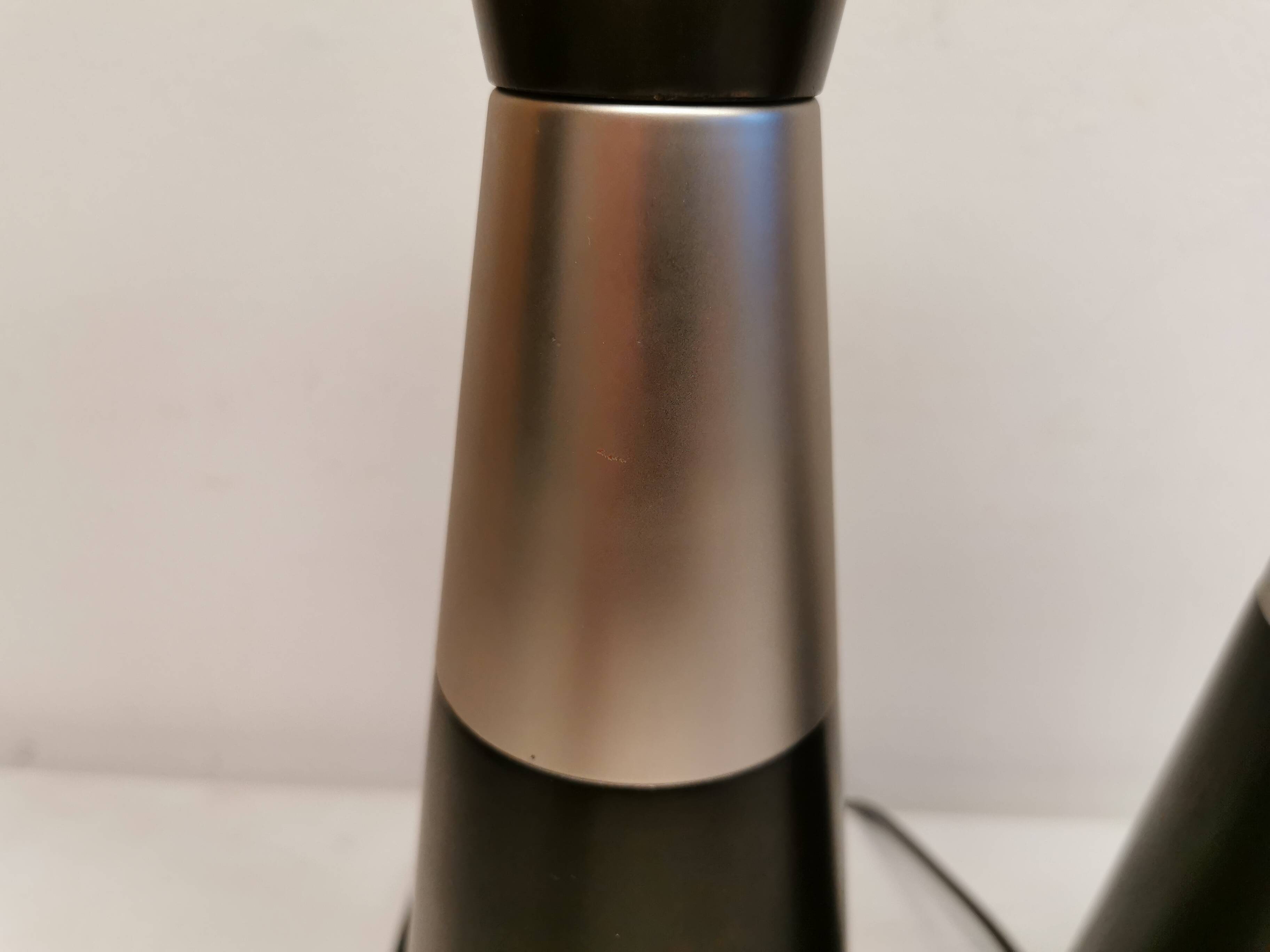 Two table lamps made of dark-stained wood with silver detail in the middle.