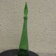 Vintage green faceted glass bottle with its cap 1970