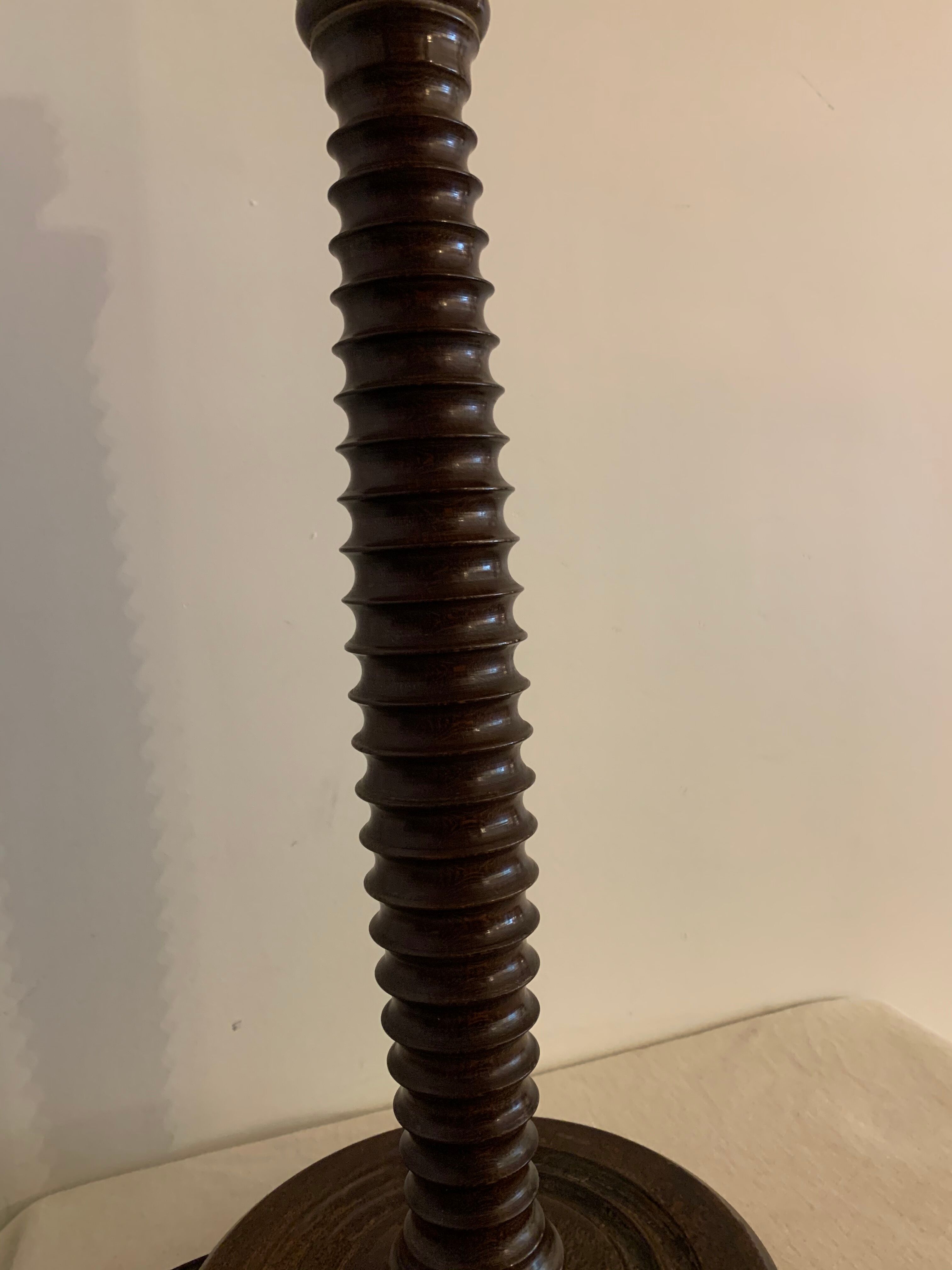 Turned wooden lamp foot in the shape of a warhead