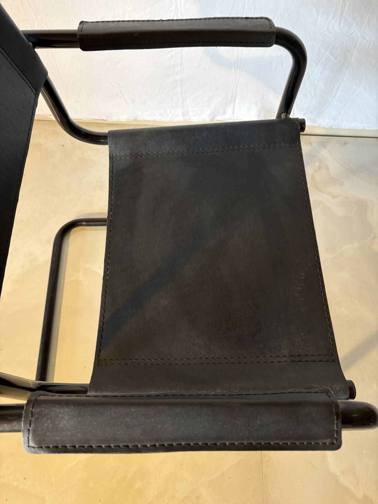 Set of 12 vintage black leather and tubular steel chairs – Italy, year