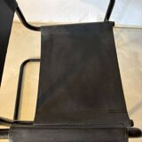 Set of 12 vintage chairs in black leather and tubular steel – Italy, 1970s