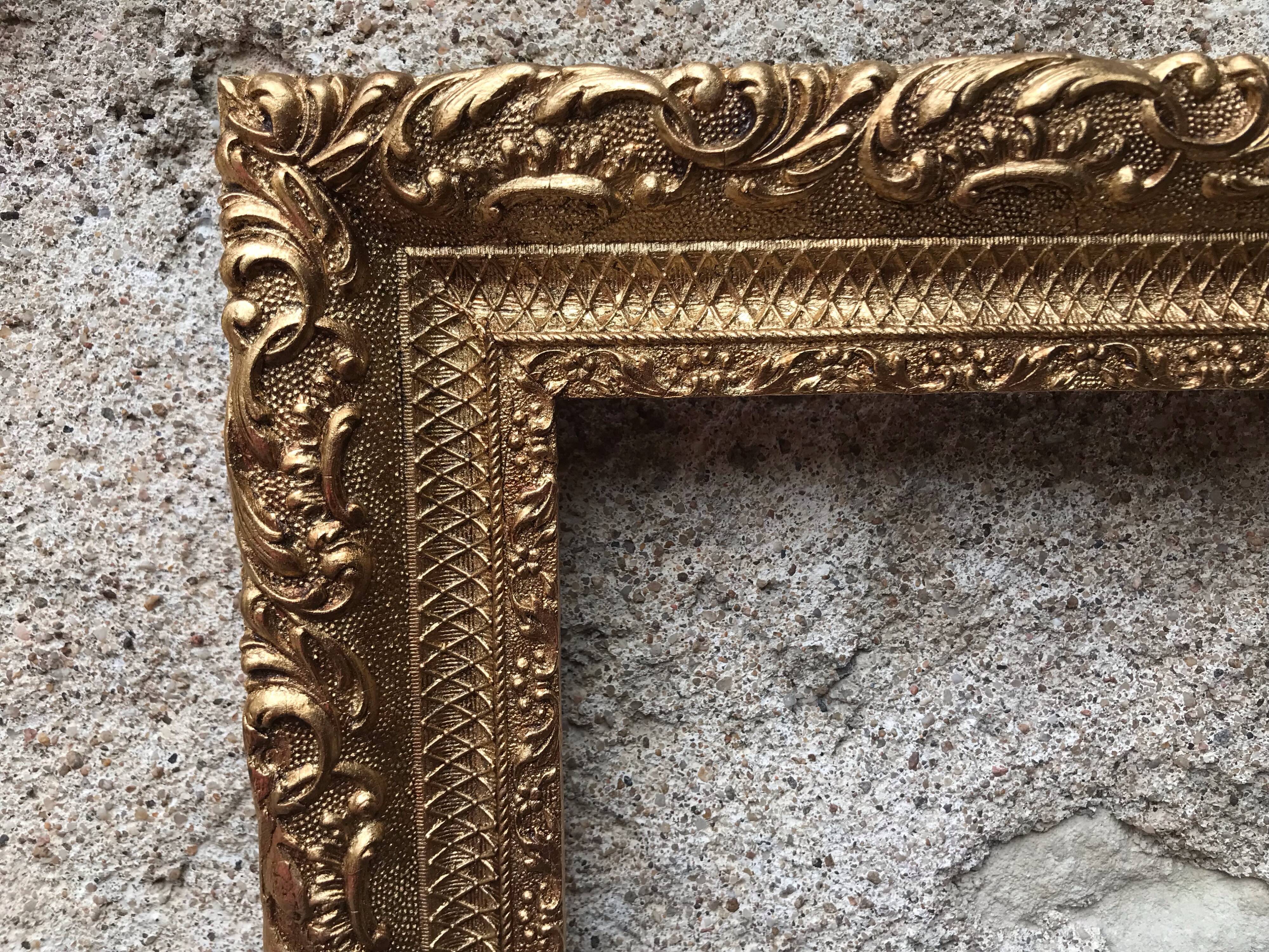 Old gilded frame with leaf