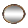 Oval-shaped bevelled mirror with cherry wooden frame 60x47cm