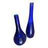2 blue glass bottles