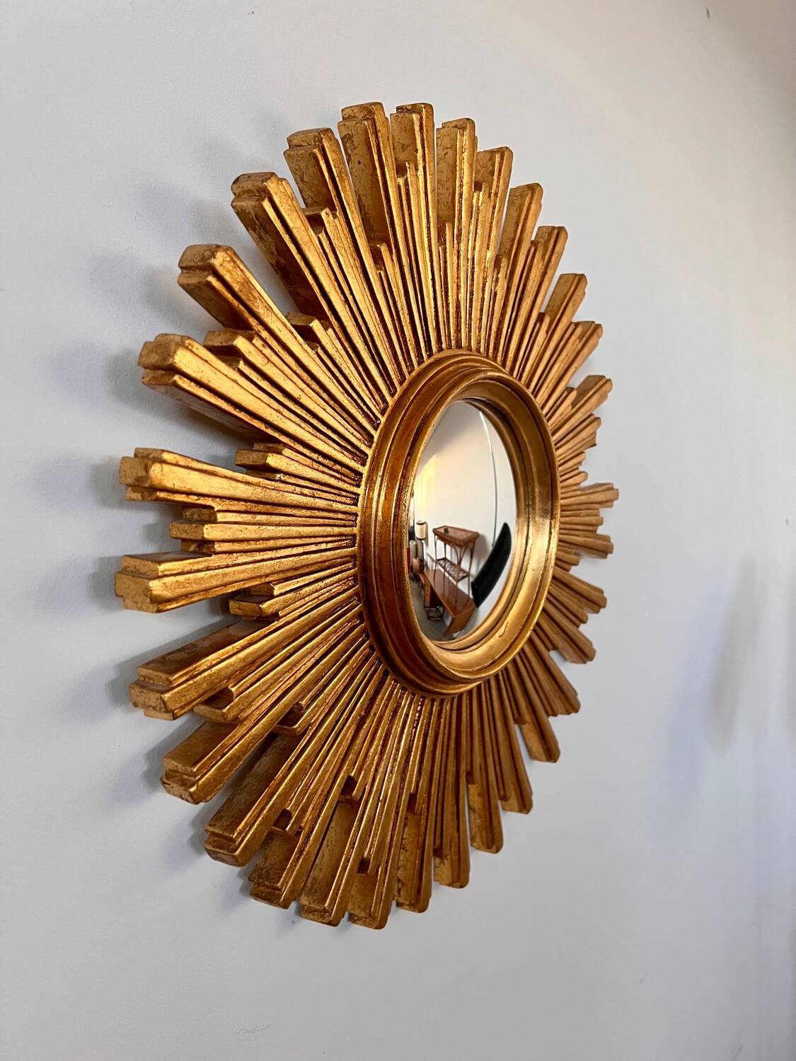 Old large golden sun mirror with rounded witch's eye in vintage resin from the 70s