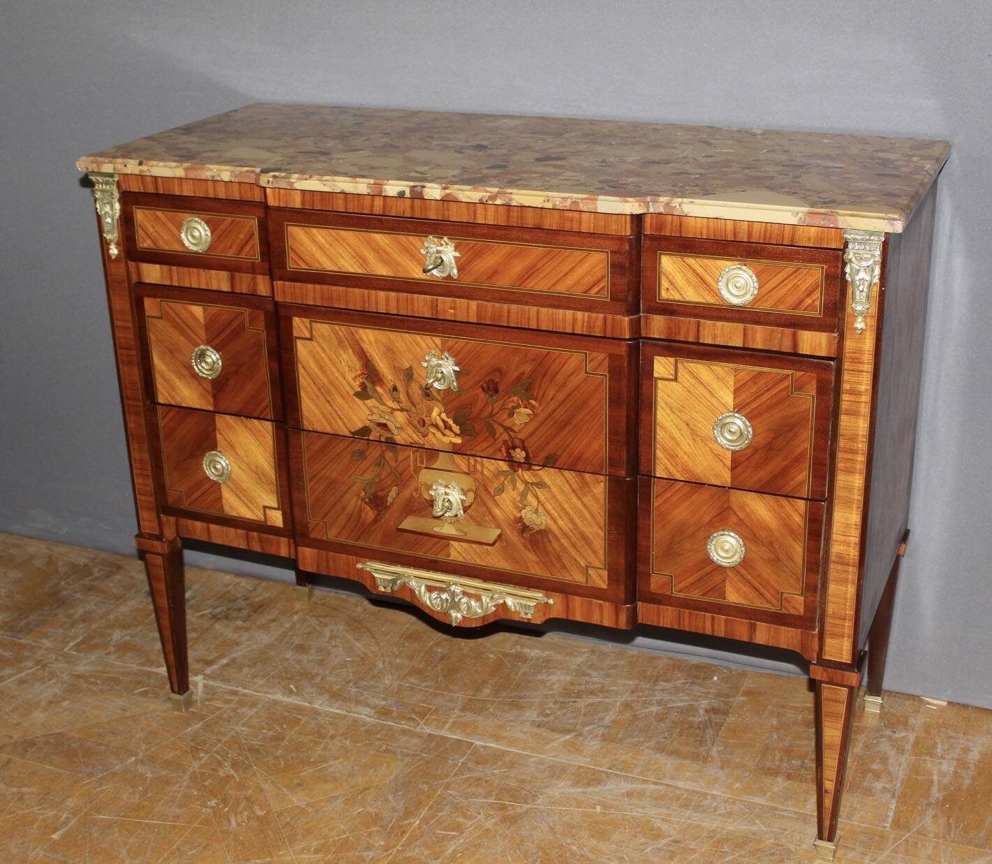 Louis XVI style commode in marquetry from around 1940.
