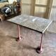 Grey marble and burgundy cast iron bistro table ☐ 85 x 57 cm