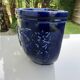 Wall pot in glazed blue terracotta with a grape motif, 1970s.