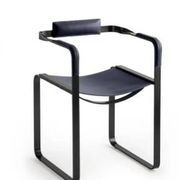 Pair of wanderlust armchairs in black and black metal.