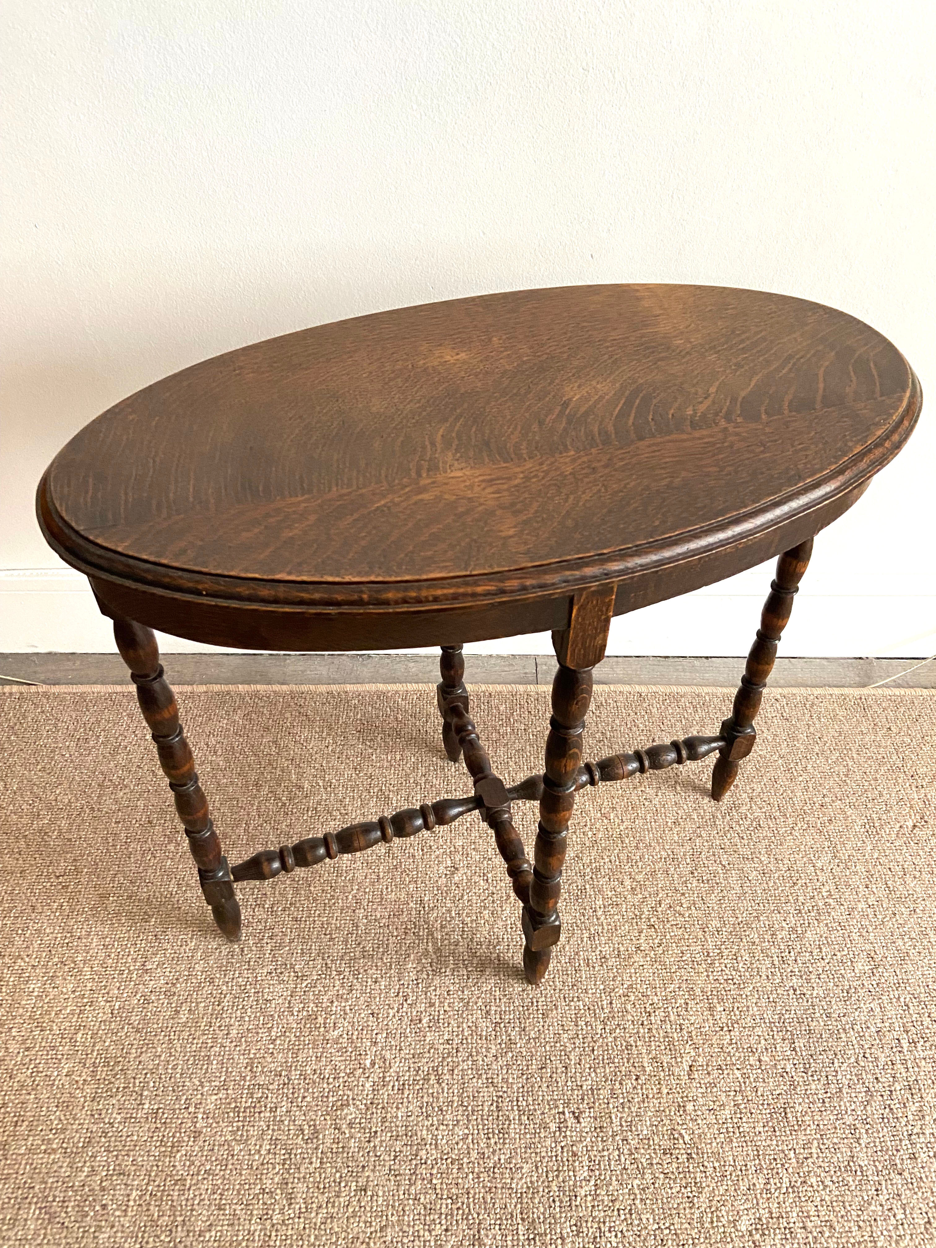 Oval wooden side table turned with spacer