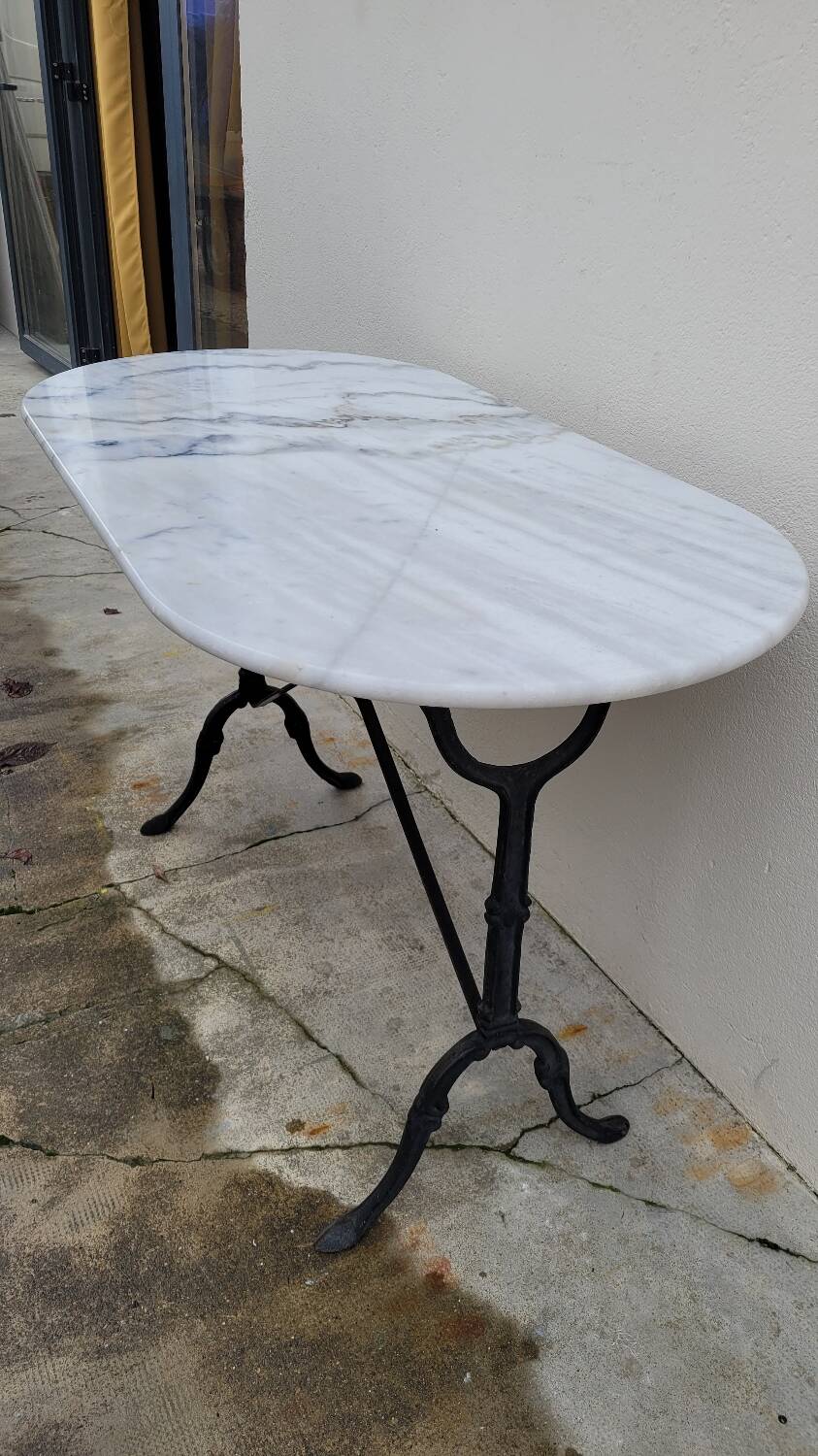 Antique cast iron bistro table with oval marble top