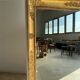 Miroir doré style Restauration à décor de palmettes étirées