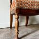 Turned wood and ochre velvet chair