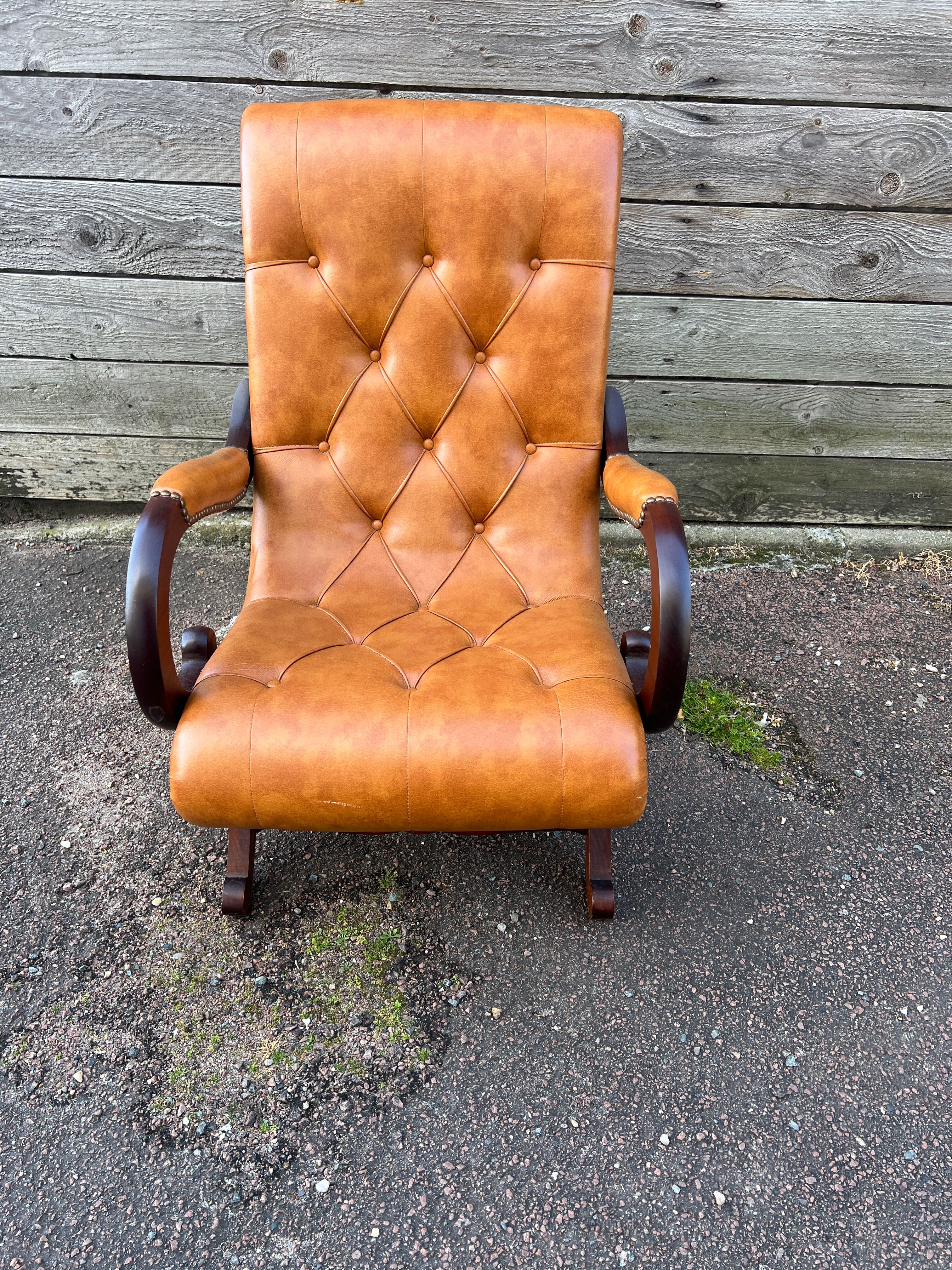 Chesterfield leather slipper chair with mahogany