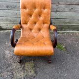 Chesterfield leather slipper chair with mahogany