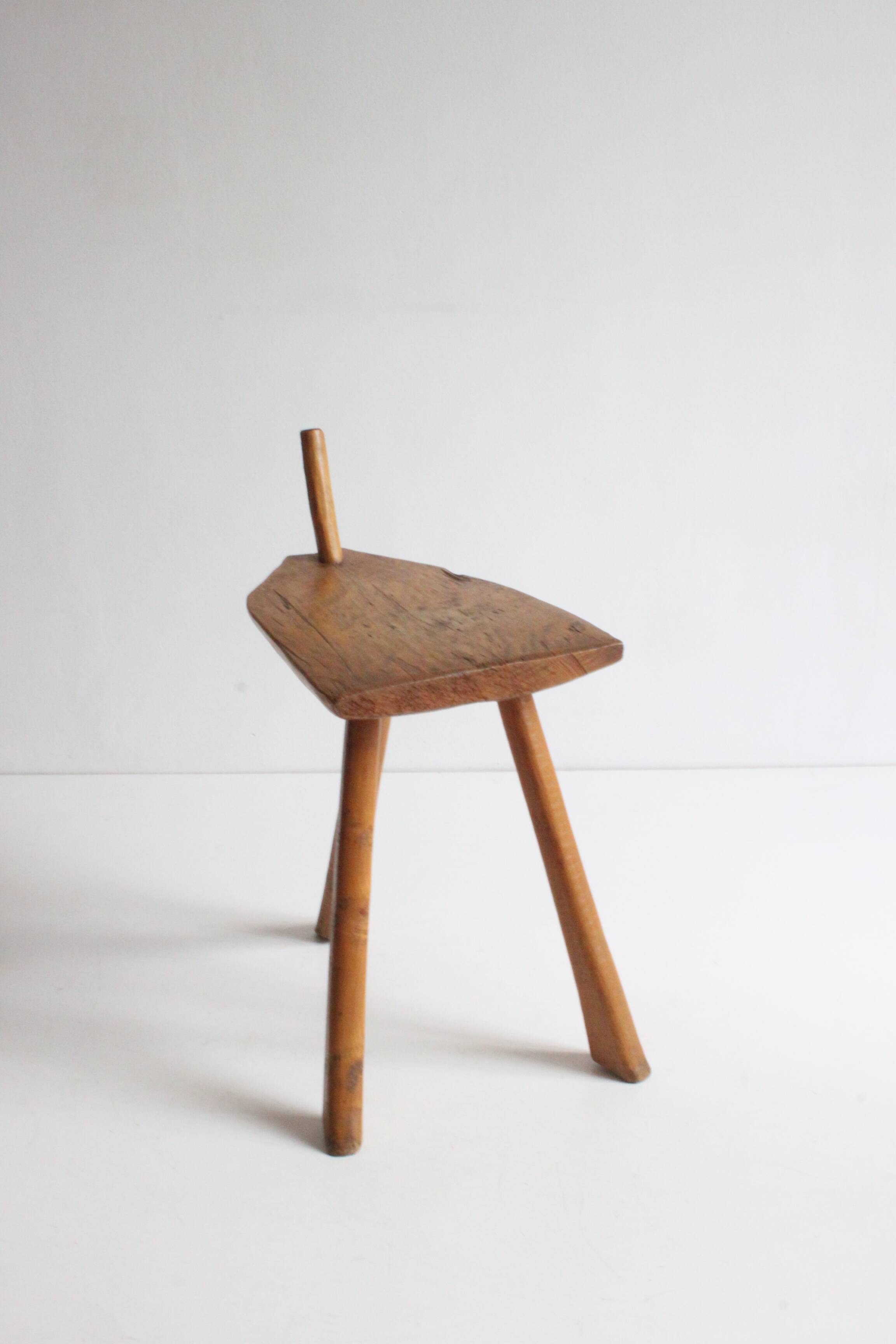 Brutalist tripod stool in carved wood, 1950s