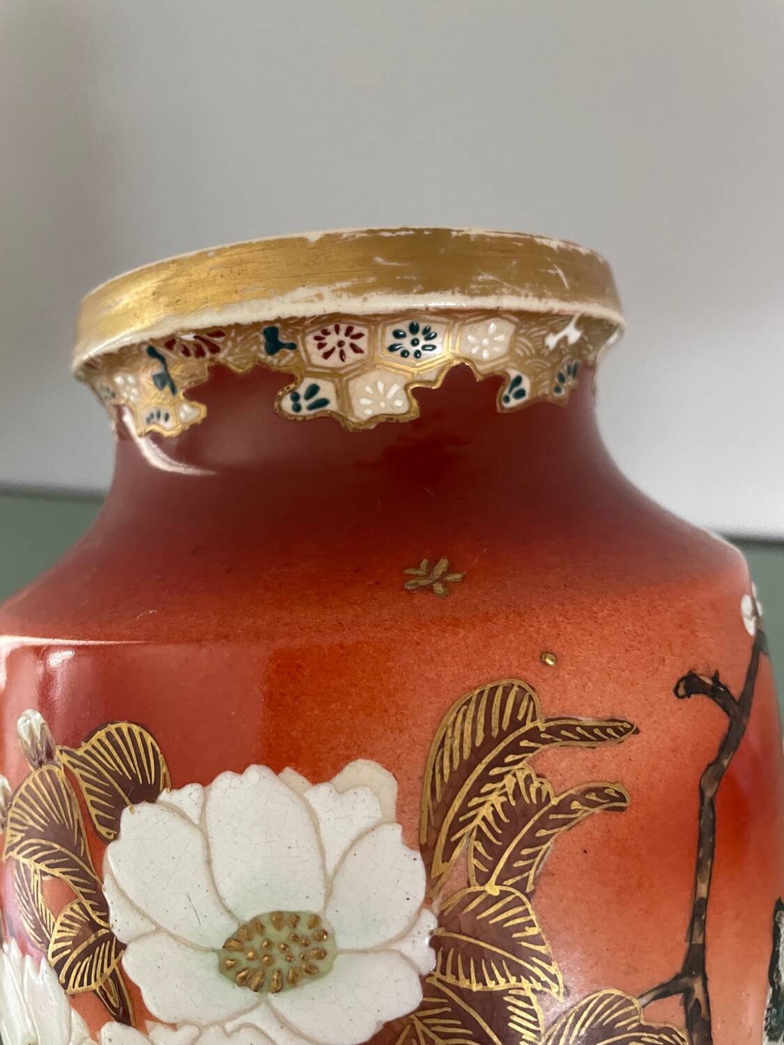 Pair of antique vases with butterfly and flower motif.