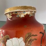Pair of antique vases with butterfly and flower motif.