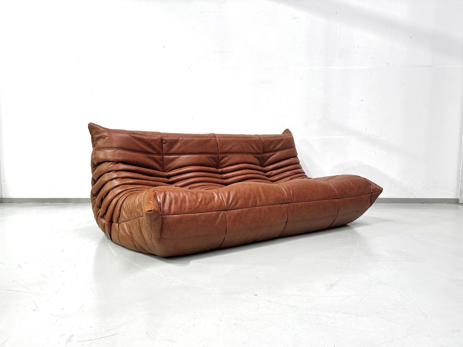 Togo sofa in cognac cowhide by Michel Ducaroy for Ligne Roset.