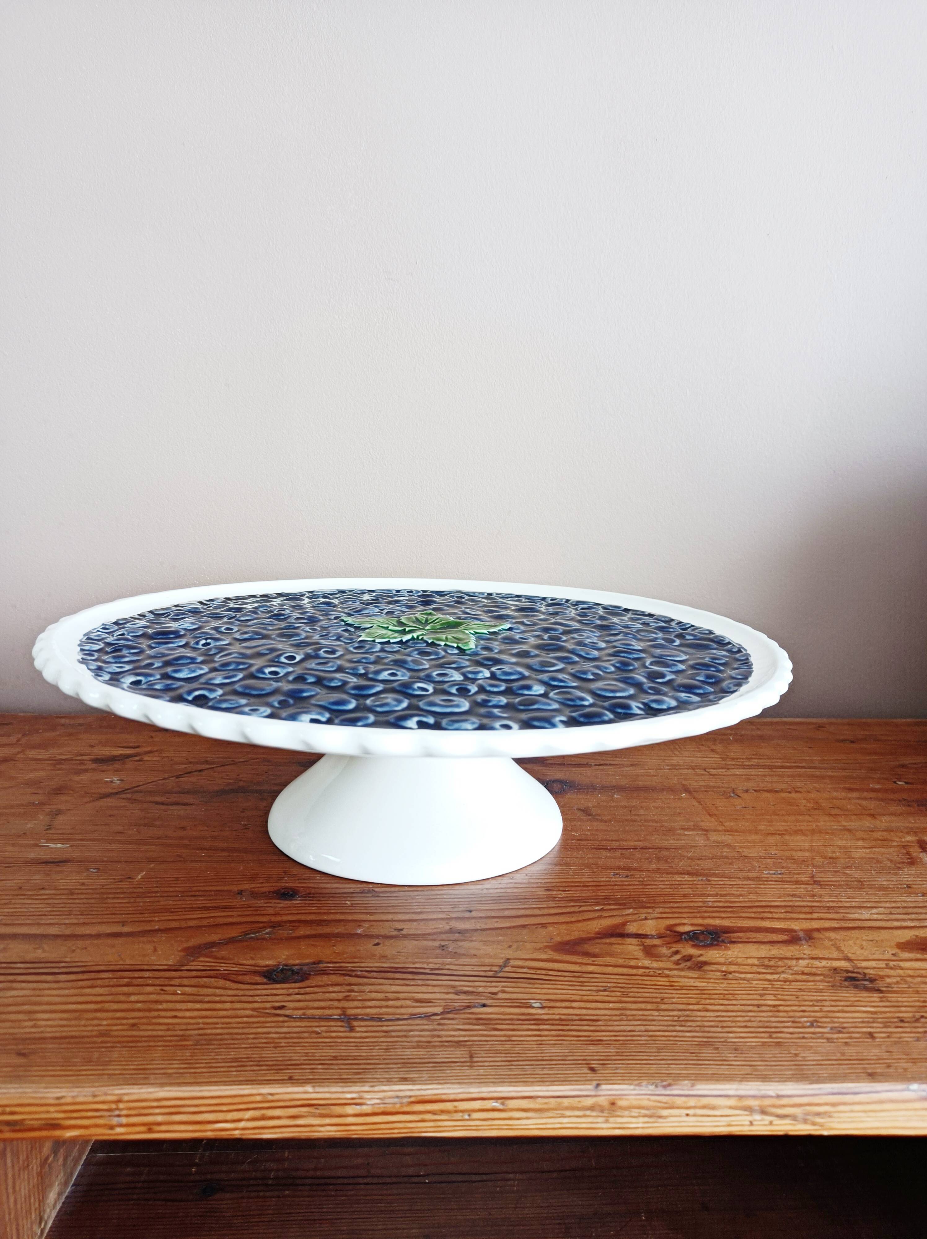 Pie dish on foot, in slip with blackberry decoration