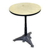 Round bistro table in cast iron and Bakelite, Louis Vuitton style, 1930s.
