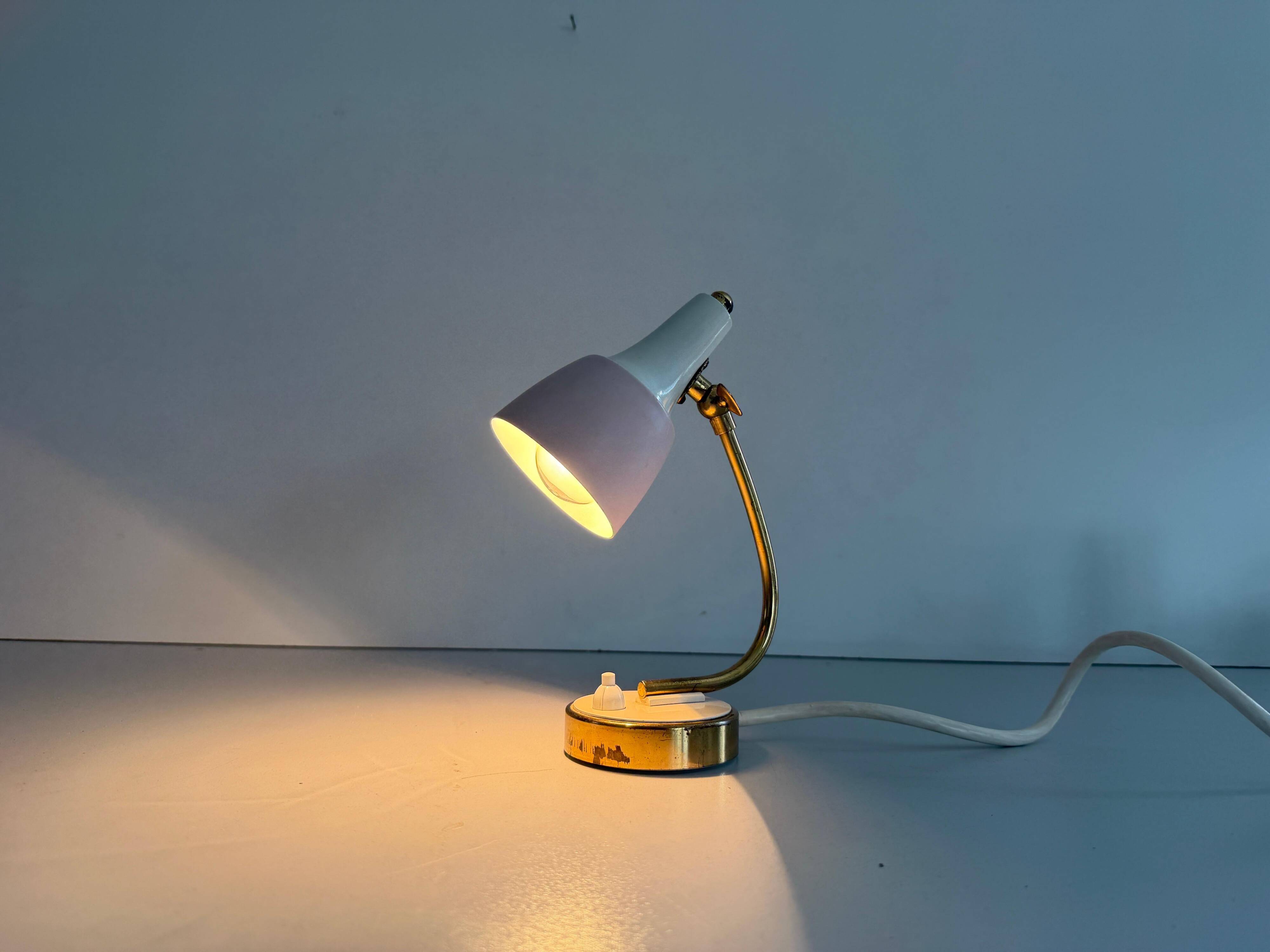 Simple table lamp with a pink metal head and brass body, 1960s, Germany.