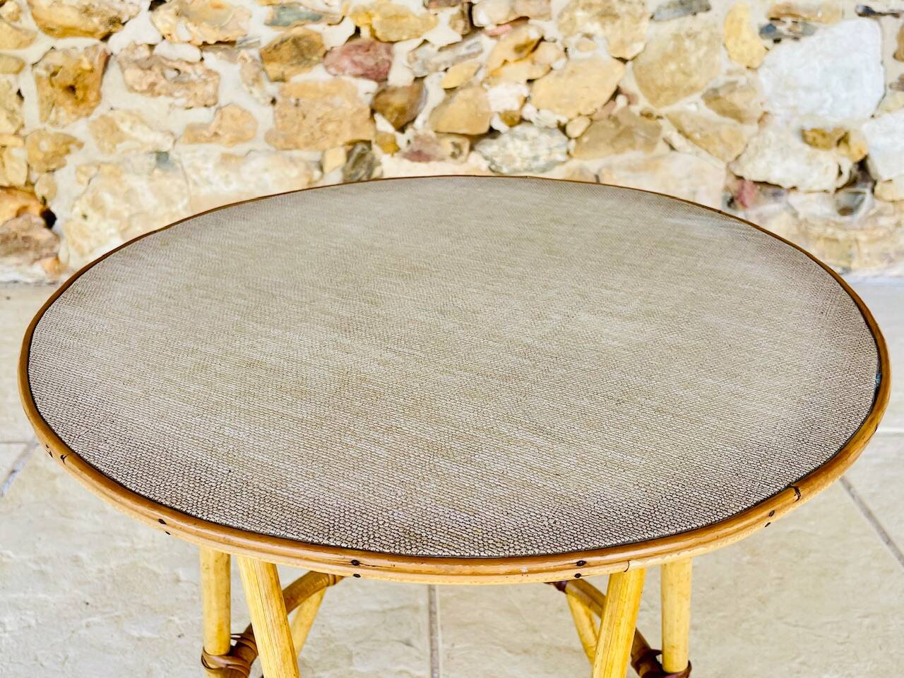 Vintage rattan and bamboo side table, circa 1969.