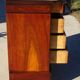 Antique mahogany chest of drawers with white marble.
