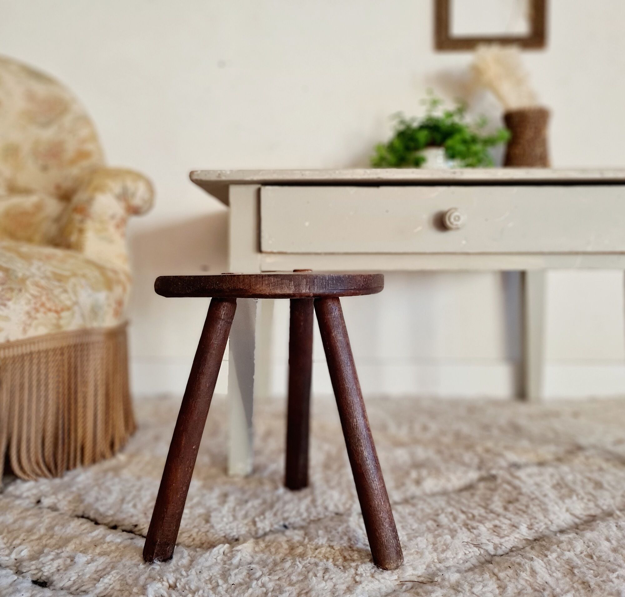 Old wooden tripod wooden farm stool made of wood