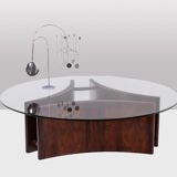 Rosewood coffee table, concave shape. 1970s.