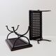 Set of 2 solid wood benches with an openwork design and wrought iron legs.
