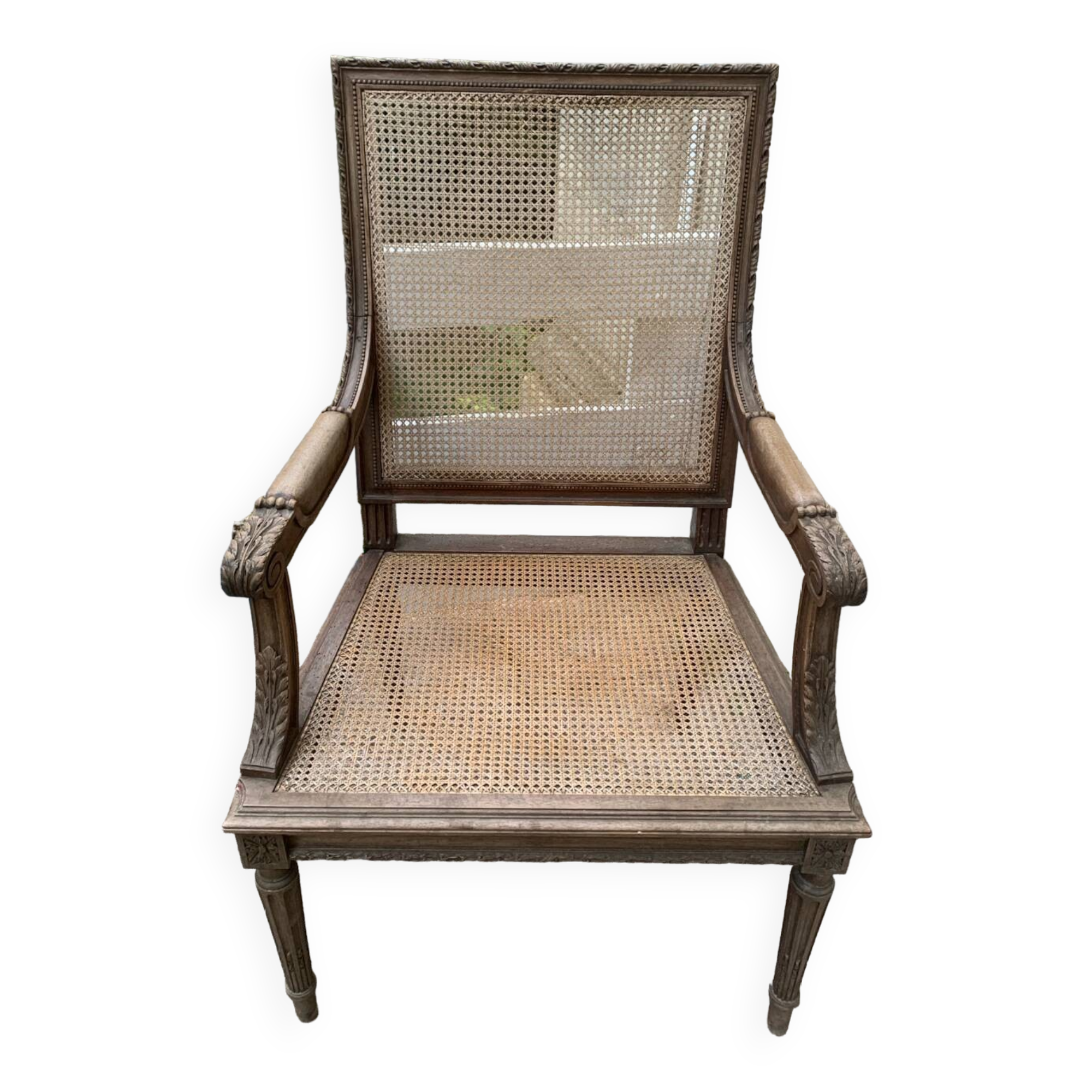 Wooden armchair with caning in Louis XVI style