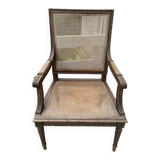 Wooden armchair with caning in Louis XVI style
