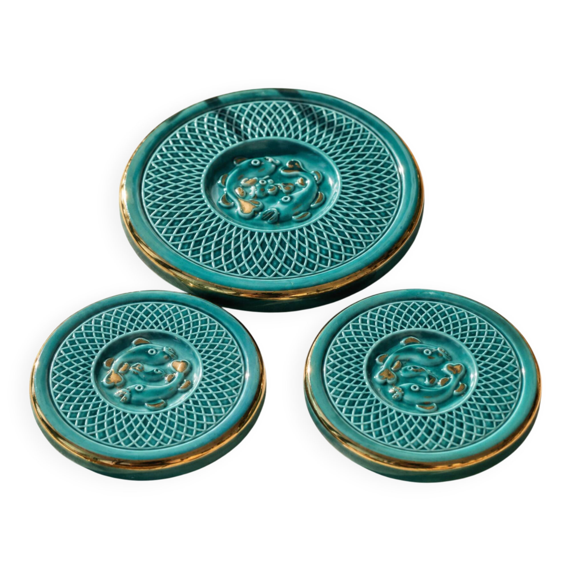 Set of 3 vintage turquoise ceramic coasters with decoration.