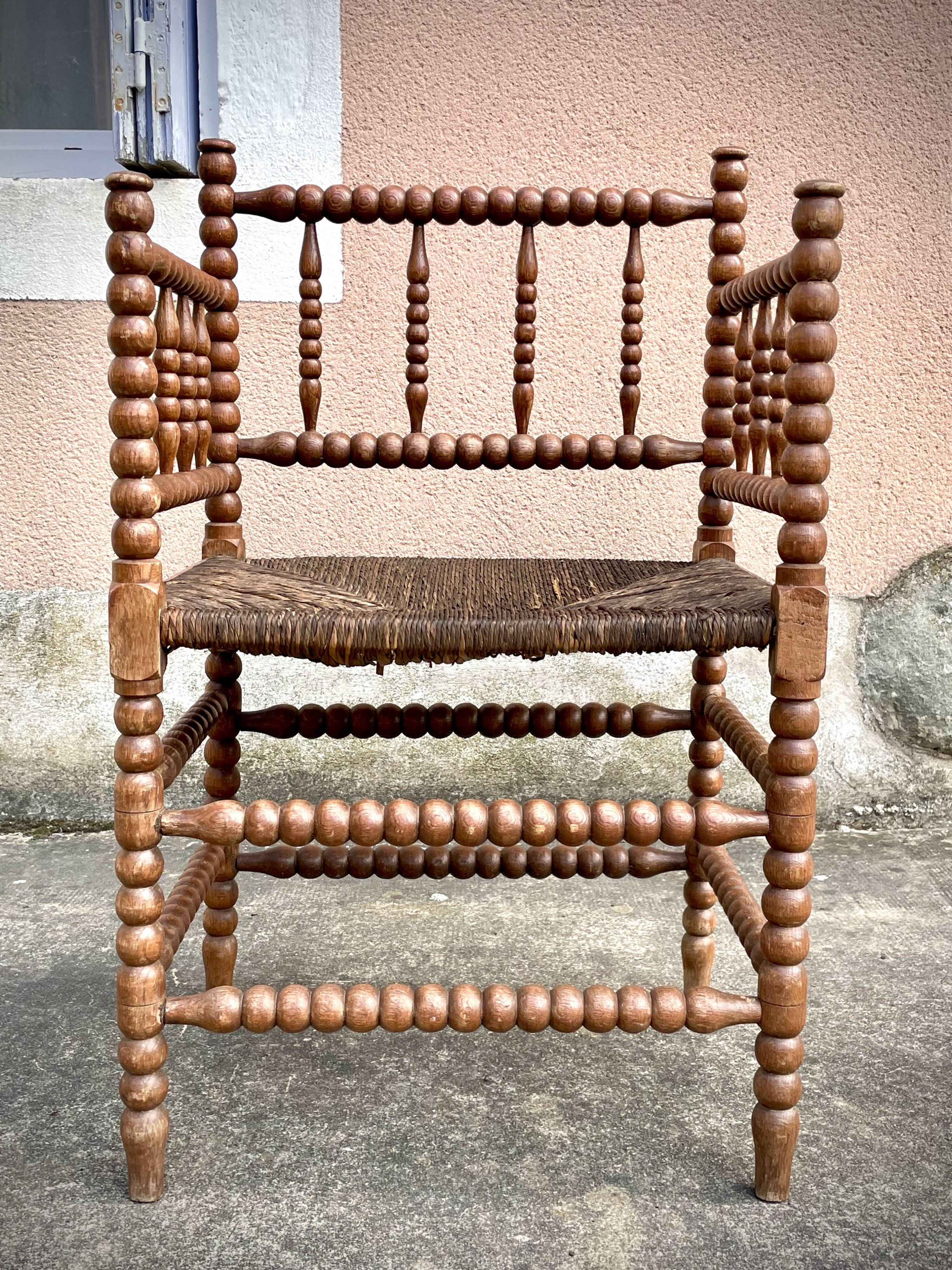 Antique Bobbin armchair with straw seat