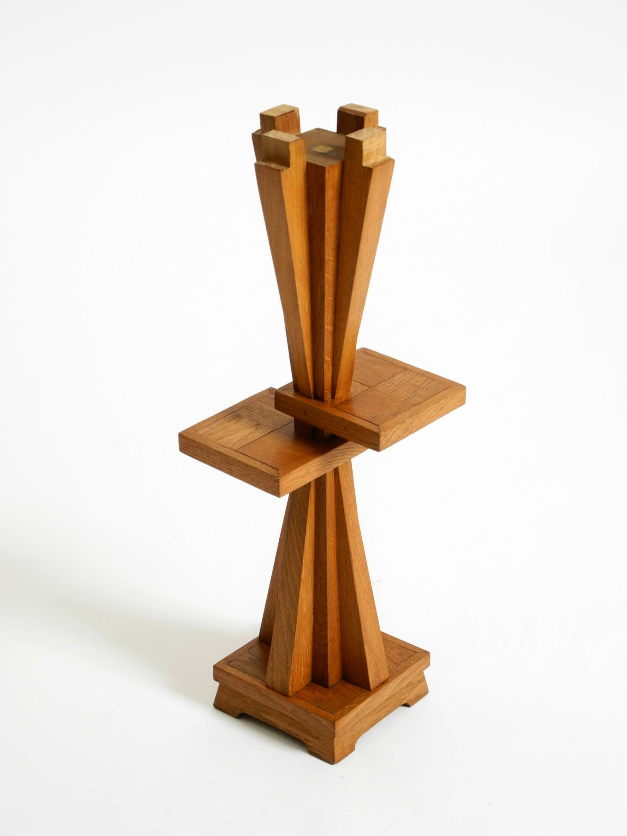 Two mid-century standing ashtrays consisting of red Alabaster cup