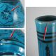 Islamic ceramic vase with turquoise background
