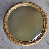 Large round mirror in Spanish gilded carved wood