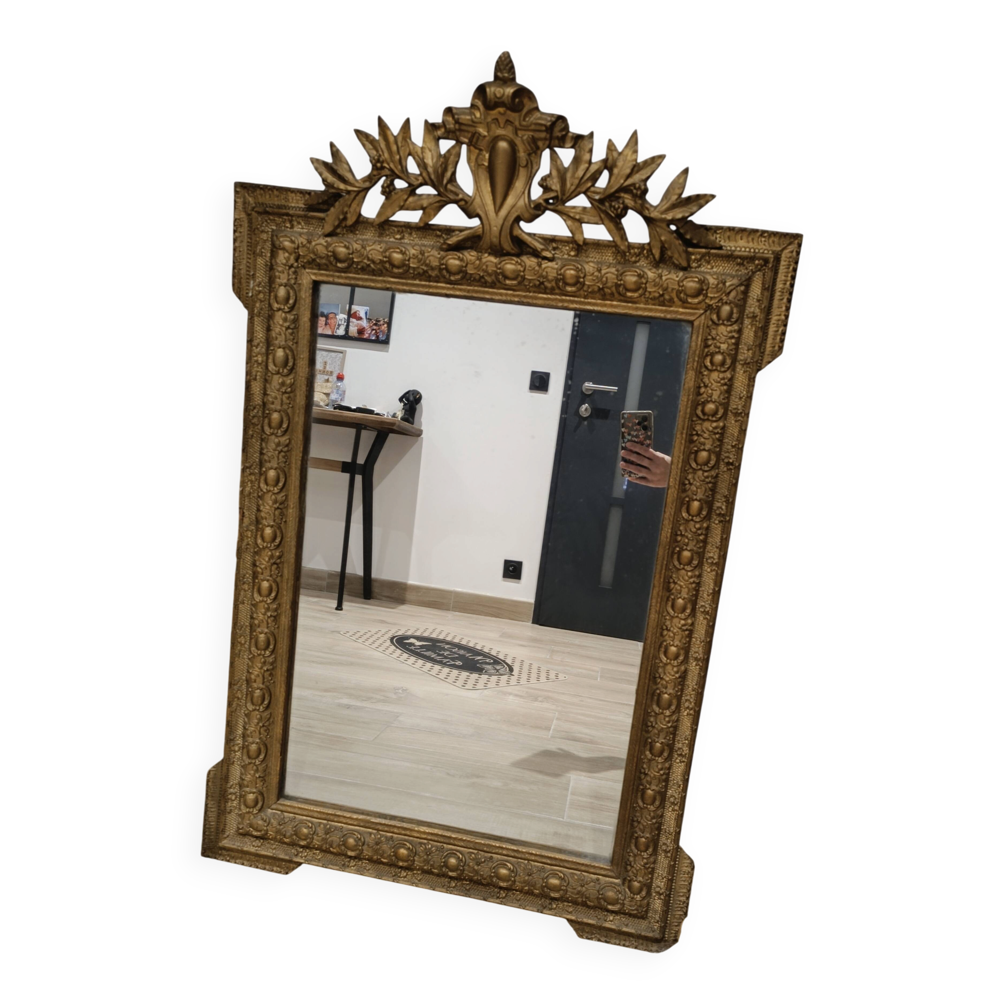 Antique mirror in Napoléon III style with a laurel pediment.